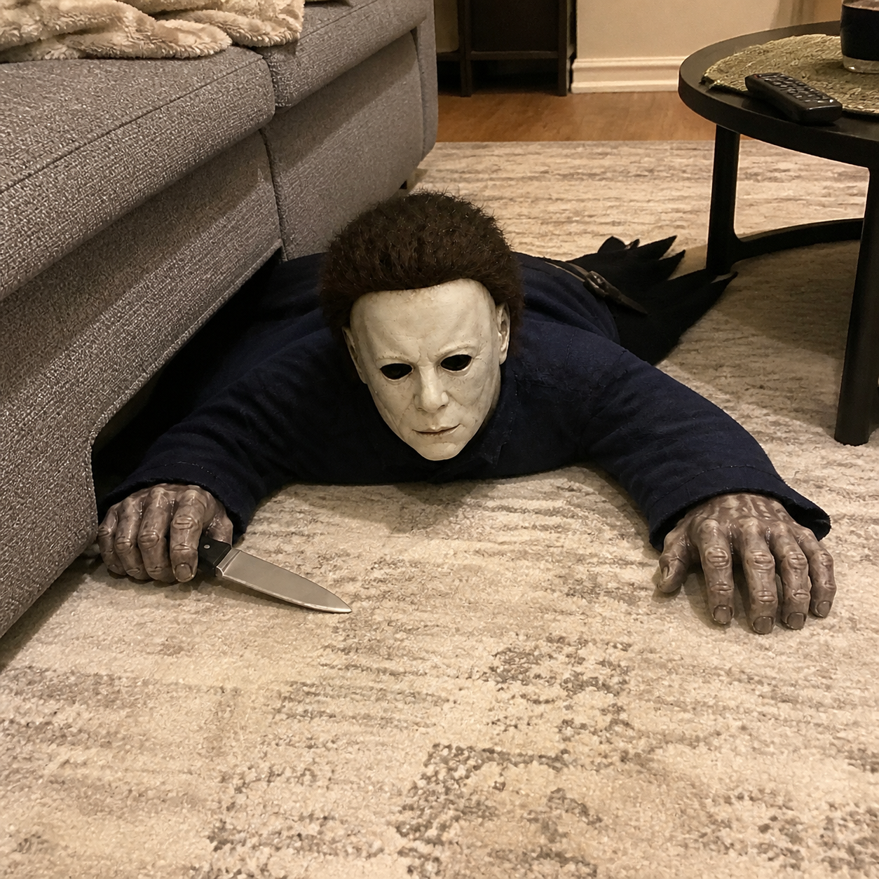 Crawling Mike beside a couch